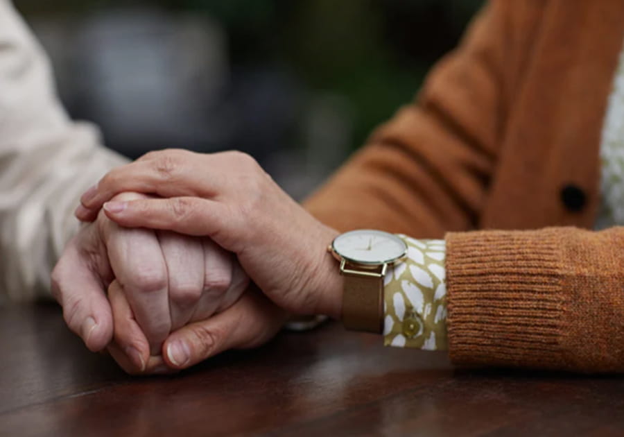 Seniors holding hands